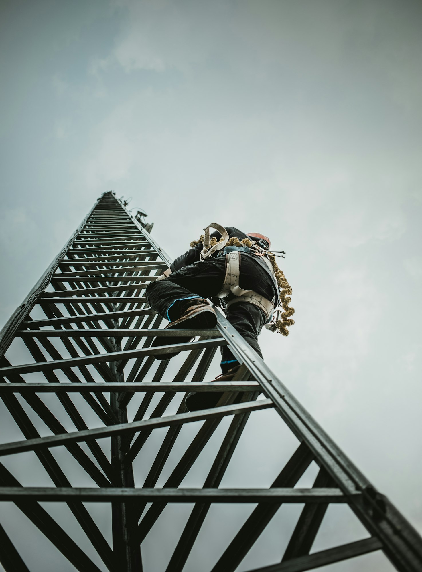 Telecom Worker Climbing Antenna Tower