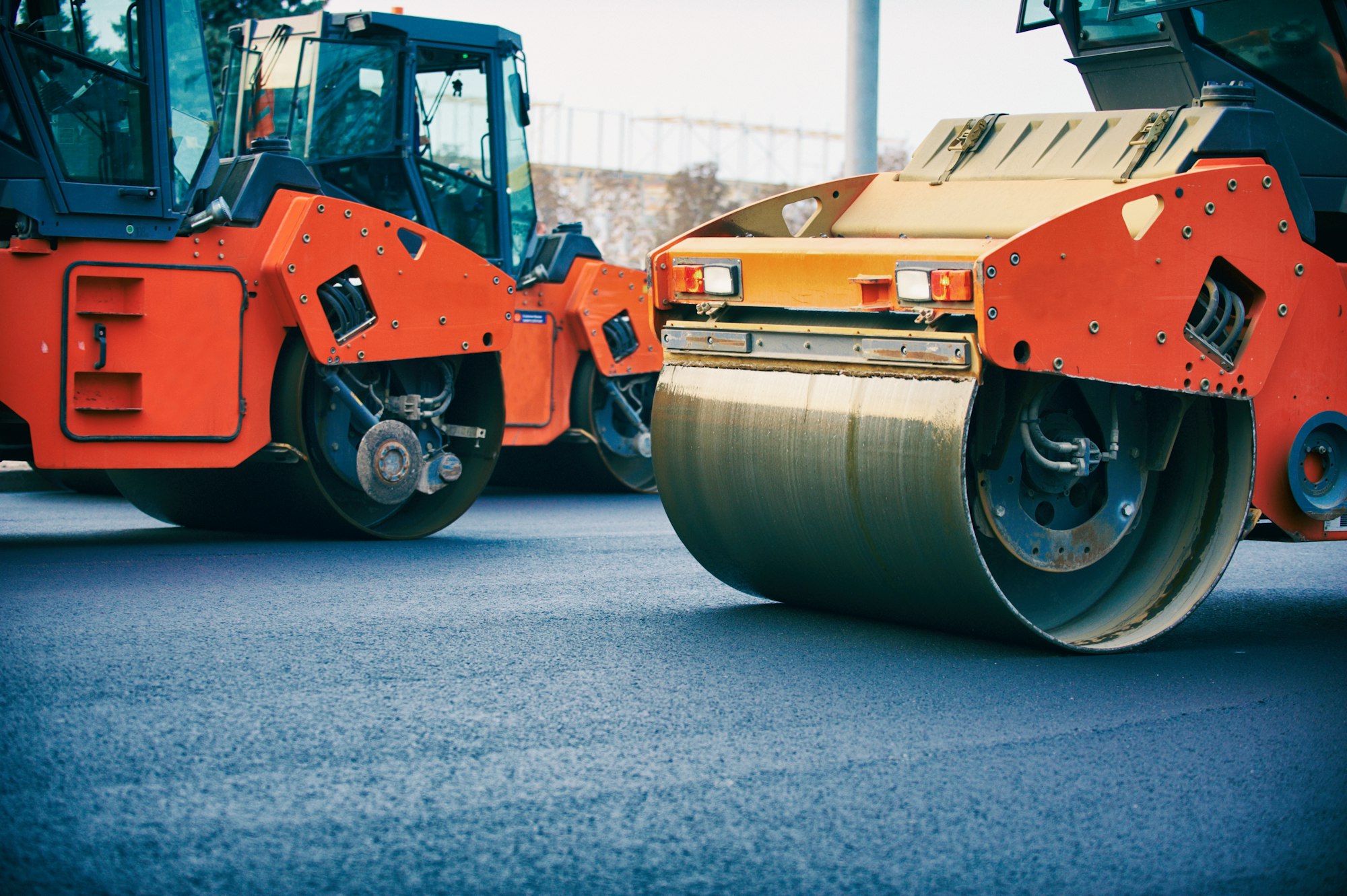 Road roller working on the new road construction site